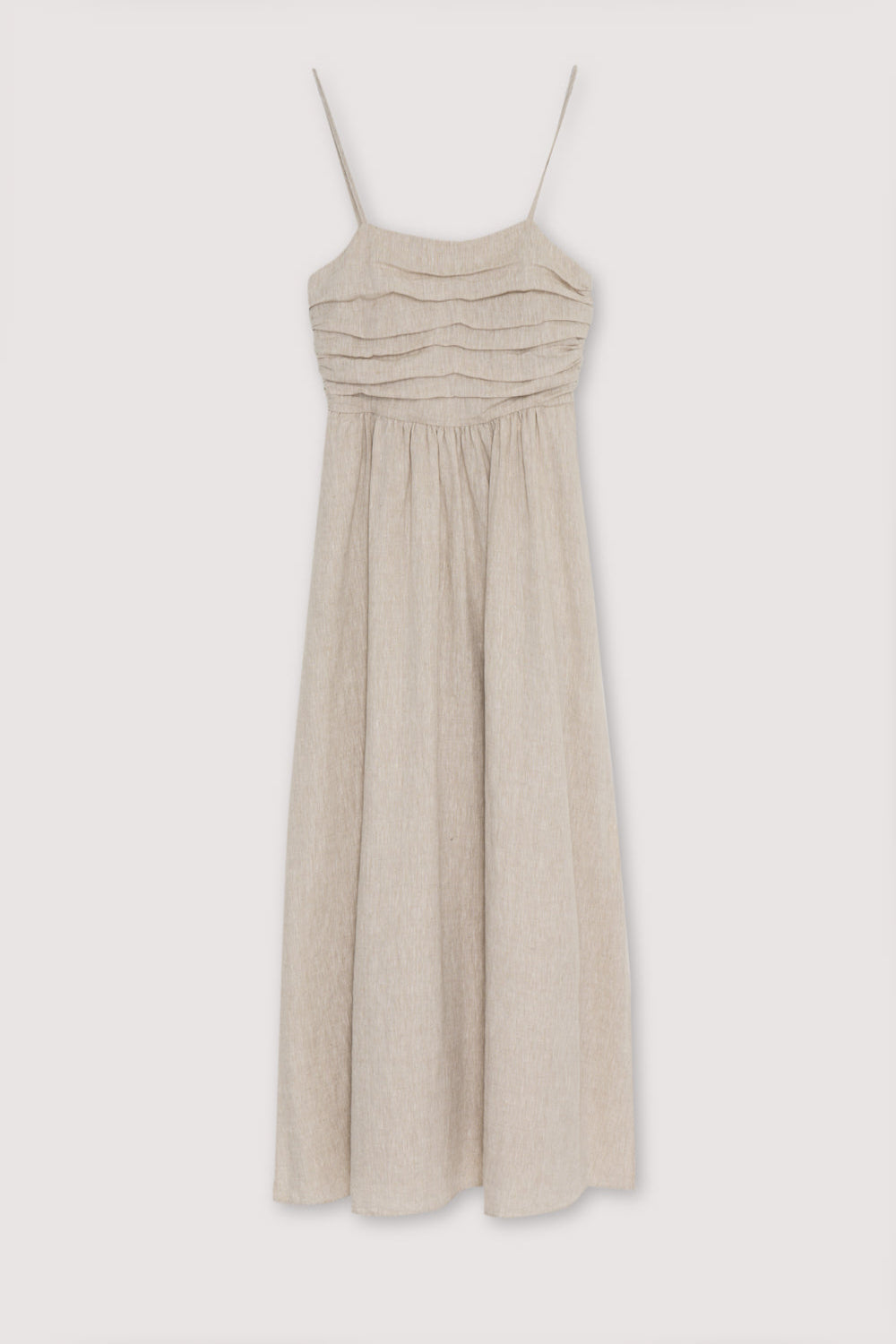 Anna Woman Dress in 100% linen fabric, with spaghetti straps, pleated panel on the top, and a long skirt with volume. Spring Summer collection. The New Society.