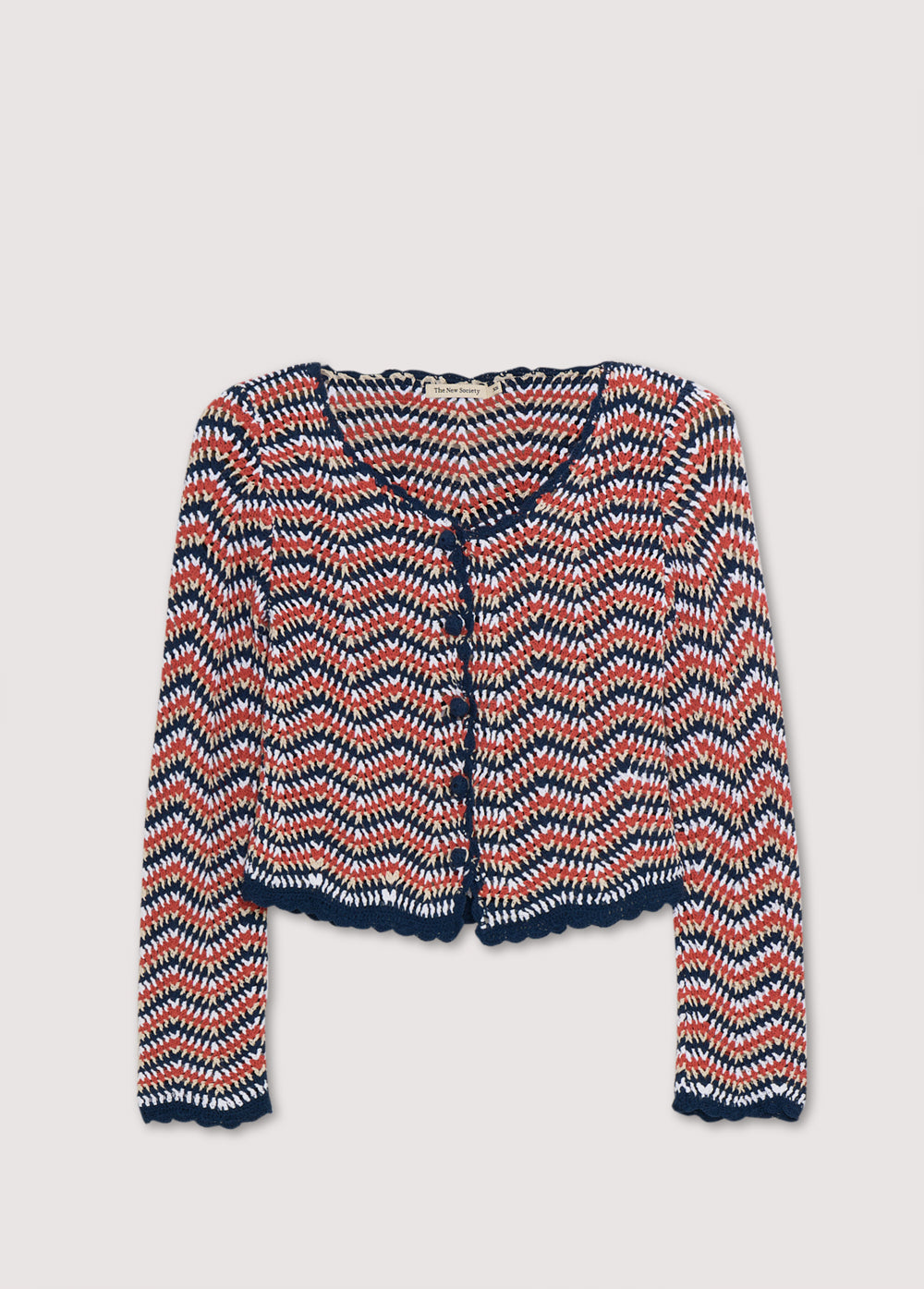 Long-sleeved tricolor crochet cardigan with front opening, curved finishes and crochet tone-on-tone buttons. This is a perfect garment to pair with matching pants. Spring Summer Collection. The New Society.