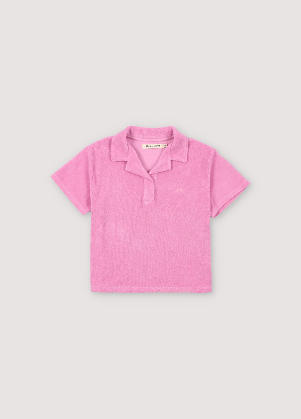 Terry fabric polo shirt with brand logo embroidery on the chest in a matching color. Perfect for pairing with the matching shorts to create a summery look. The New Society. kids collection
