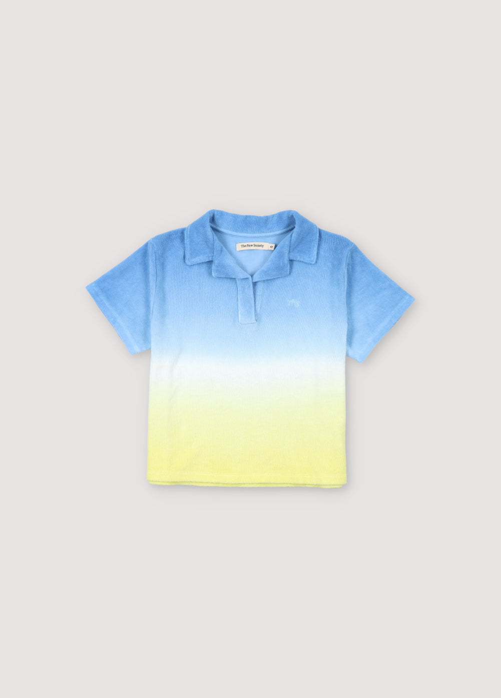 Tie-dye terry fabric polo shirt with brand logo prominently embroidered on the chest. Perfect for pairing with the matching shorts to create a summery look.