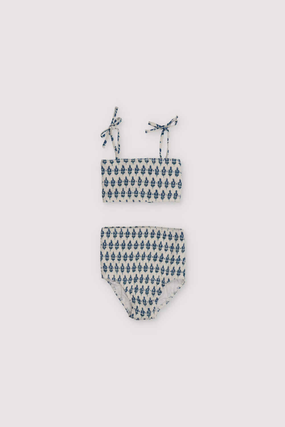 Bikini with stamp print and smocking on both pieces, featuring straps to tie on the shoulders.