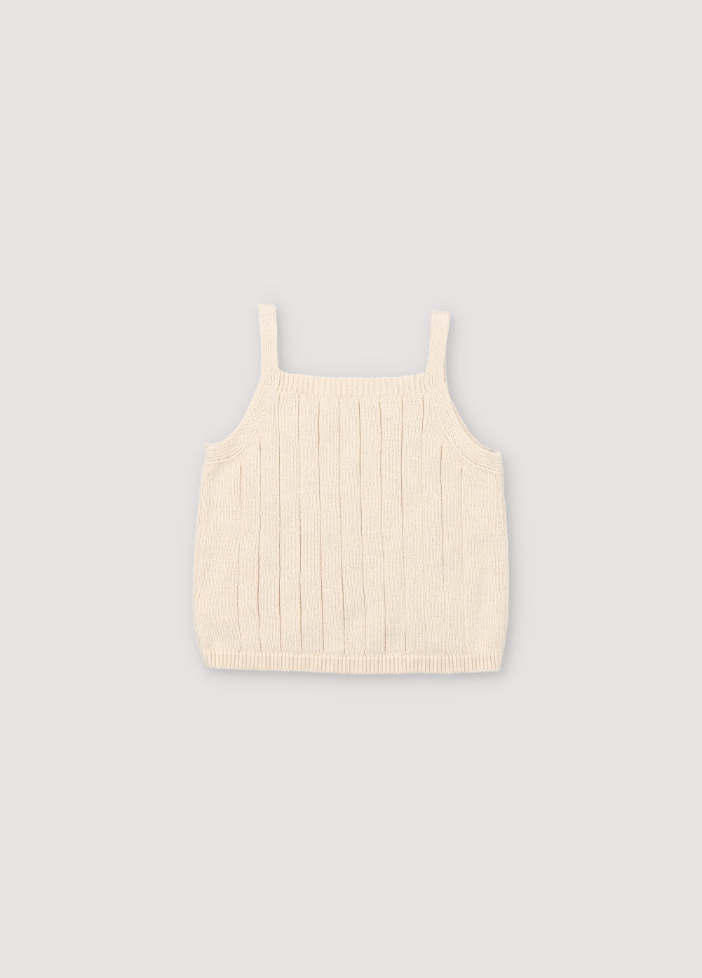 Crop-style knit top with structure and flower details. Perfect for pairing with the rest of the garments in the set.
