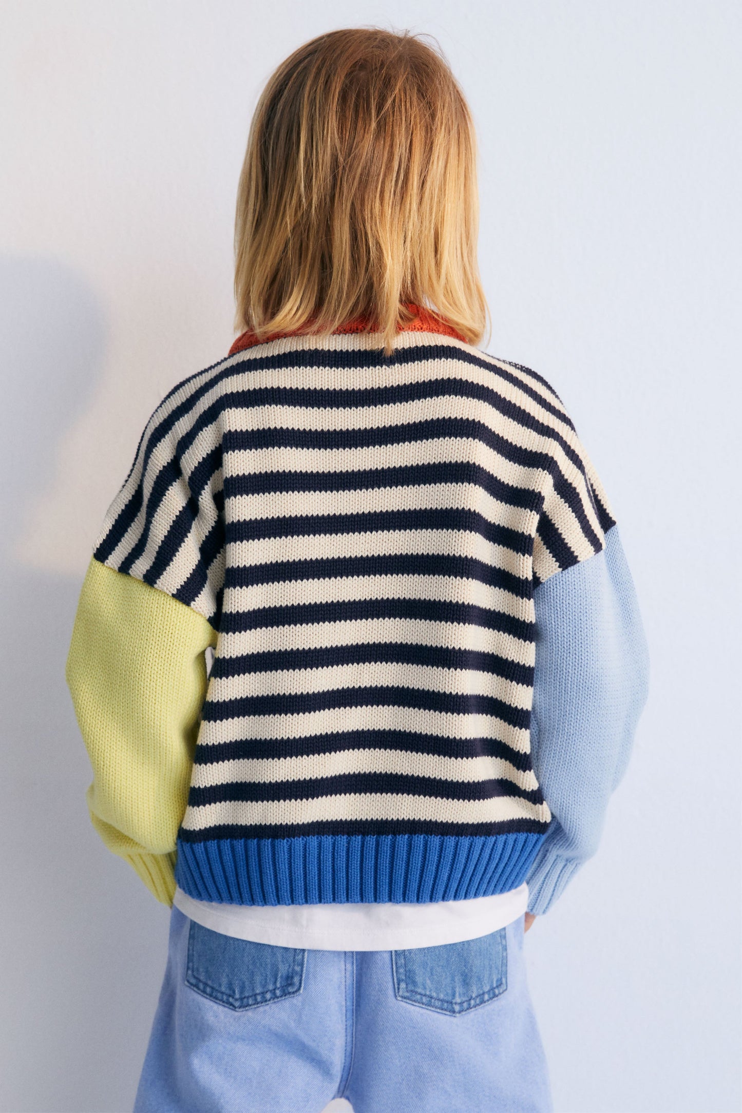 Fun and colorful cotton sweater with ribbed neckline, cuffs, and hem, featuring contrast brand embroidery on the chest. The New Society. Kids Collection.