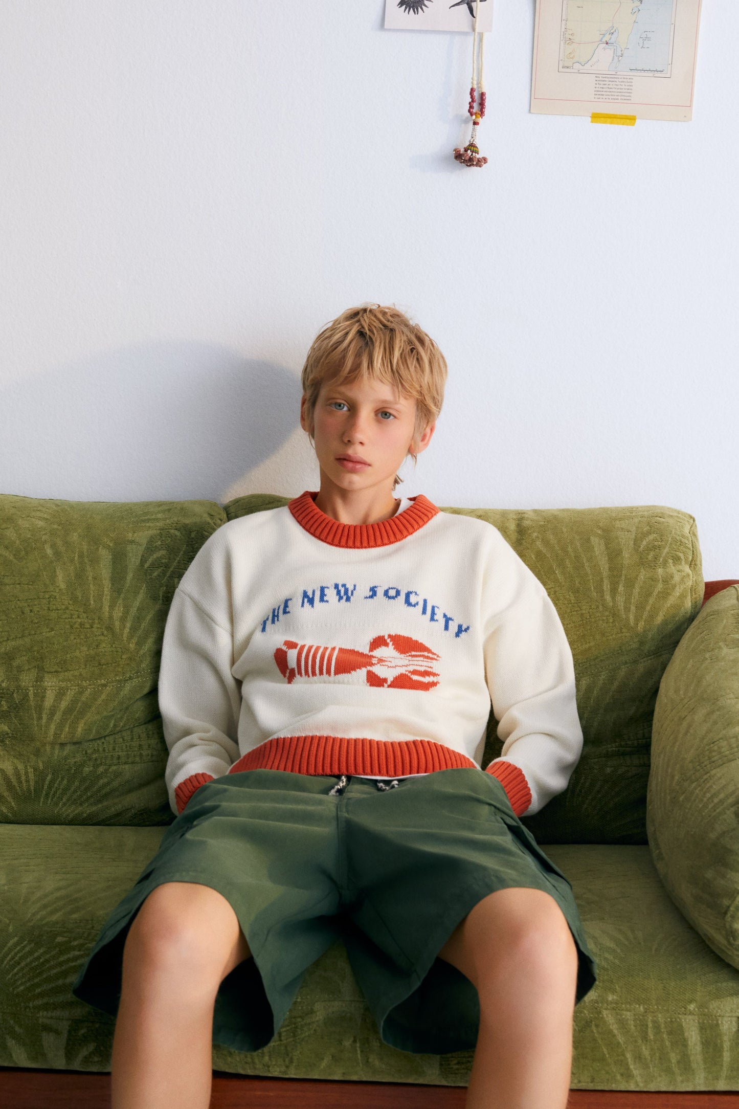 Sweater with contrast ribs on the neckline, cuffs, and hem, and our lobster jacquard on the front, making it a fun garment.