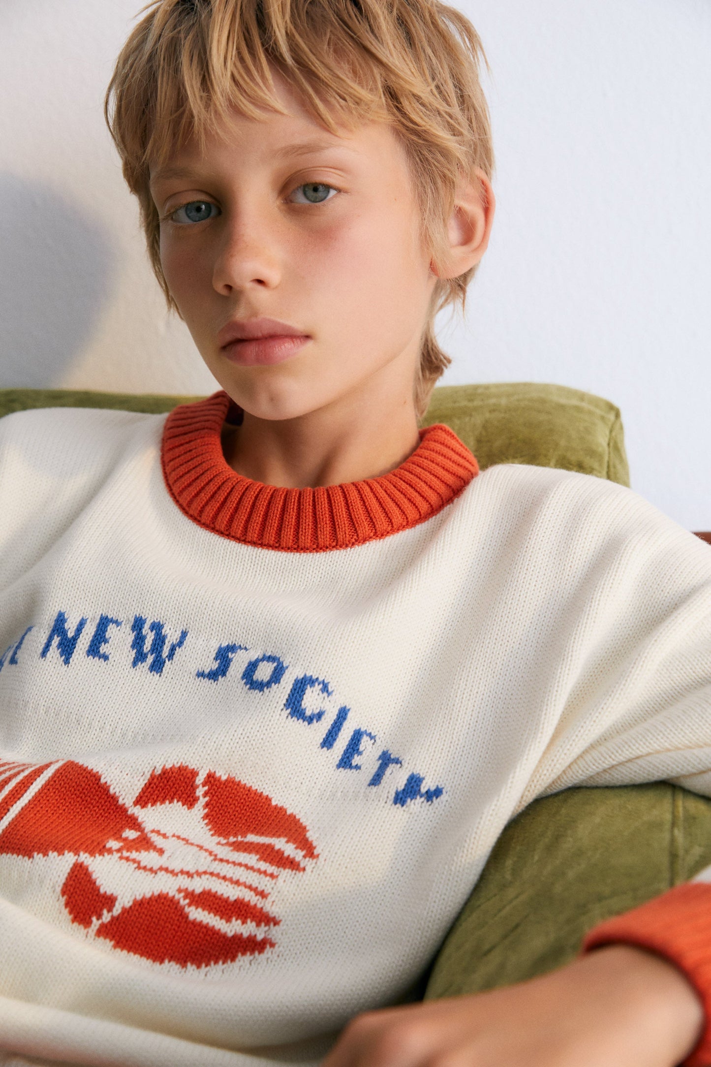 Sweater with contrast ribs on the neckline, cuffs, and hem, and our lobster jacquard on the front, making it a fun garment.