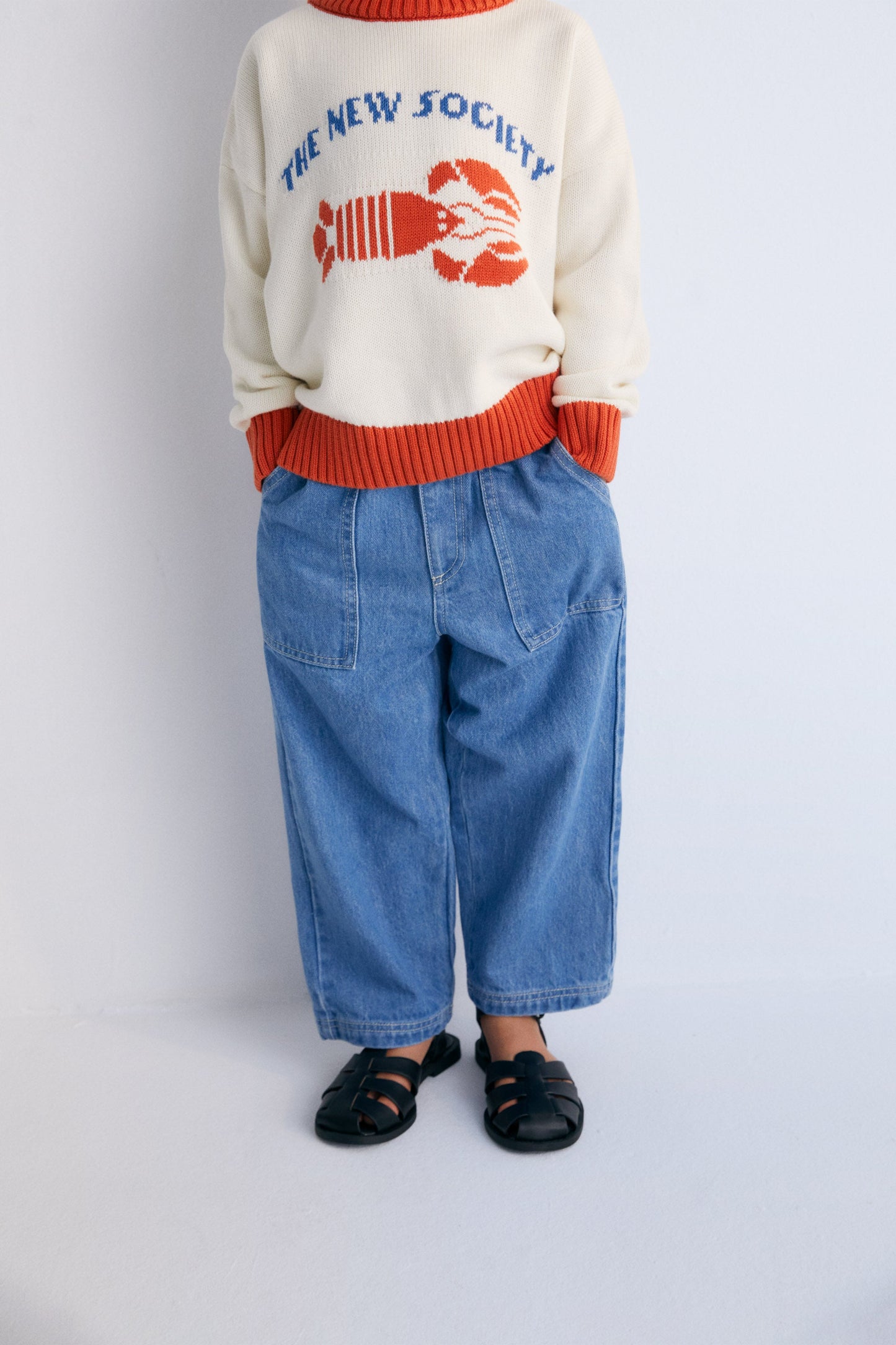 Sweater with contrast ribs on the neckline, cuffs, and hem, and our lobster jacquard on the front, making it a fun garment.