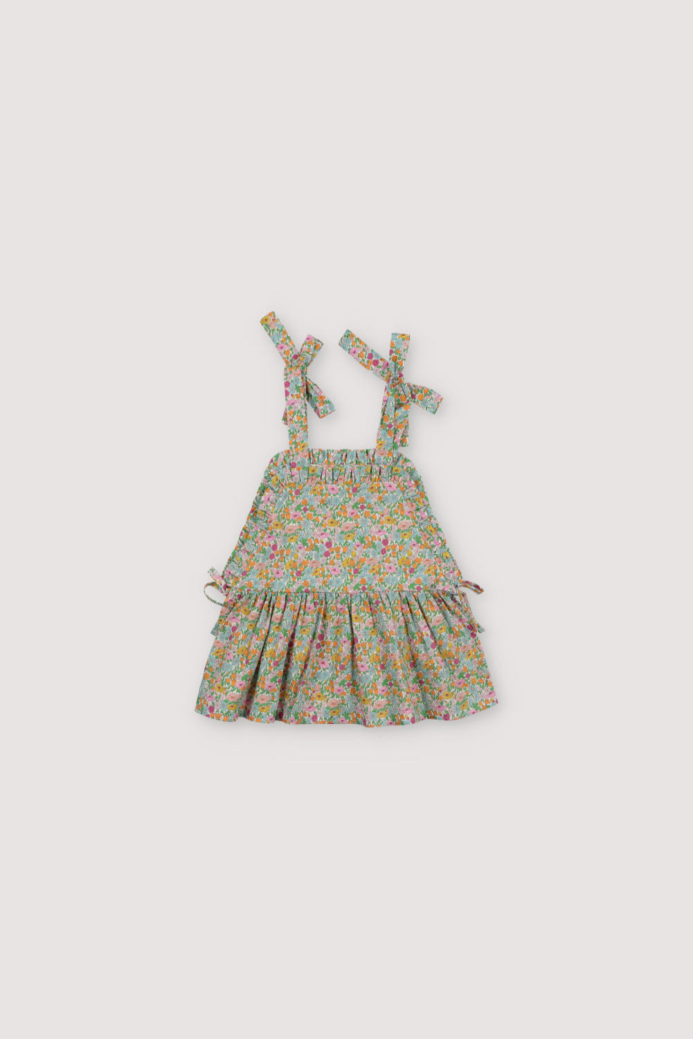 
Andreas Top in Liberty fabric 100%cotton, with shoulder bows, front ruffles, and a cut to create volume in the ruffle.