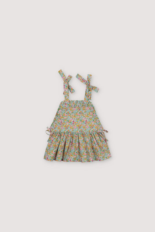 
Andreas Top in Liberty fabric 100%cotton, with shoulder bows, front ruffles, and a cut to create volume in the ruffle.