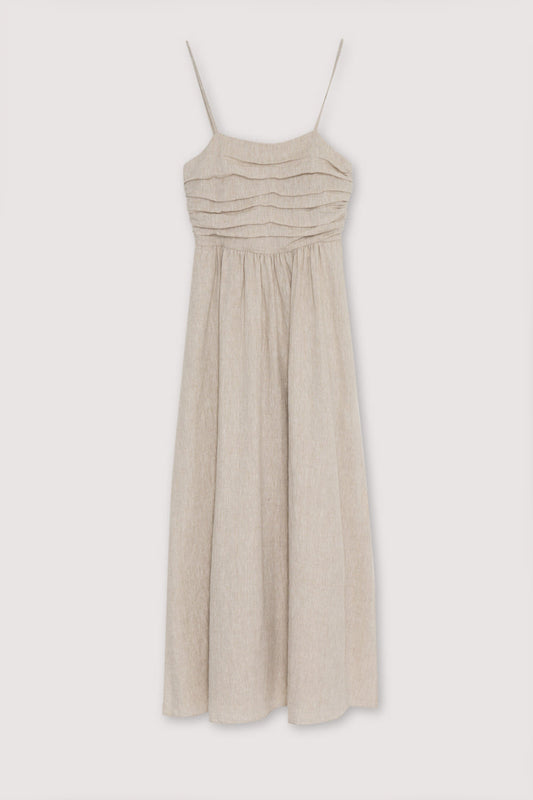 Anna Woman Dress in 100% linen fabric, with spaghetti straps, pleated panel on the top, and a long skirt with volume. Spring Summer collection. The New Society. 
