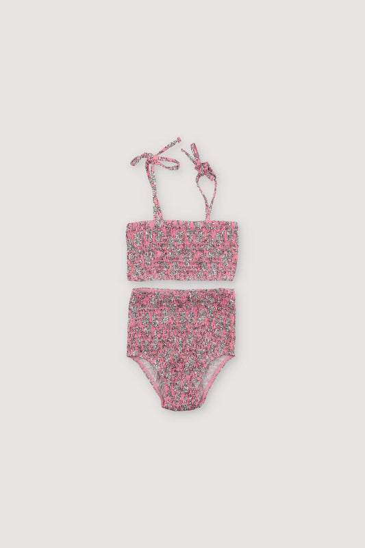Bikini with floral print and smocking on both pieces, featuring straps to tie on the shoulders.

