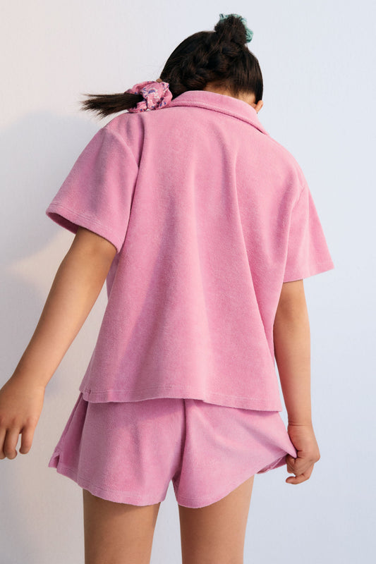 Briseis polo shirt with brand logo  embroidery on the chest in a matching color. Perfect for pairing with the matching shorts to create a summery look. The New Society. kids collection