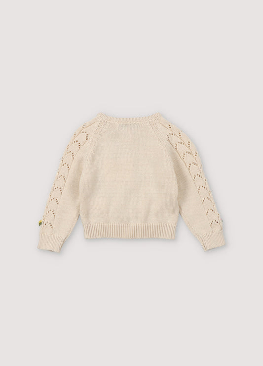Cardigan with structure and flower details. It has a wooden button opening. Perfect to match with the bloomer and hat. Spirng Summer Collection. The New Society.