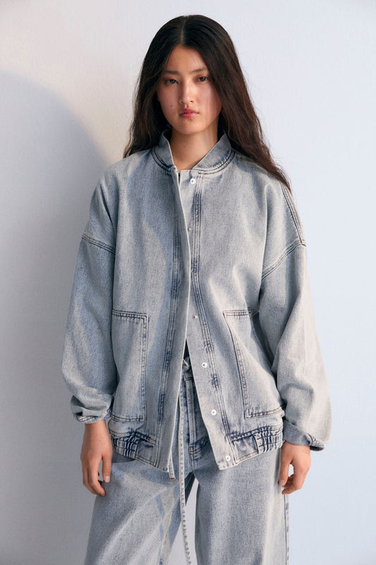 Chios Woman Bomber, our bestseller. Jacket in denim fabric 100% cotton, with front pockets and a central zipper. Spring Summer Collection. The New Society.