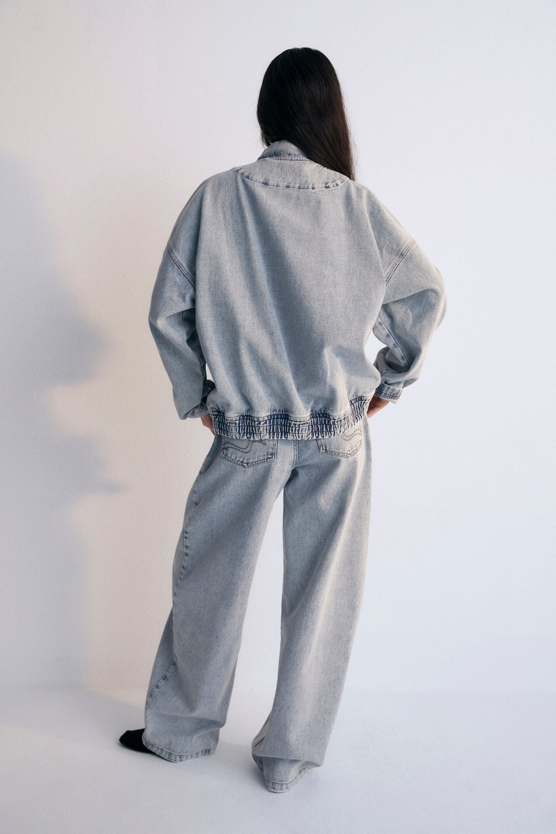 Chios Woman Bomber, our bestseller. Jacket in denim fabric 100% cotton, with front pockets and a central zipper. Spring Summer Collection. The New Society.