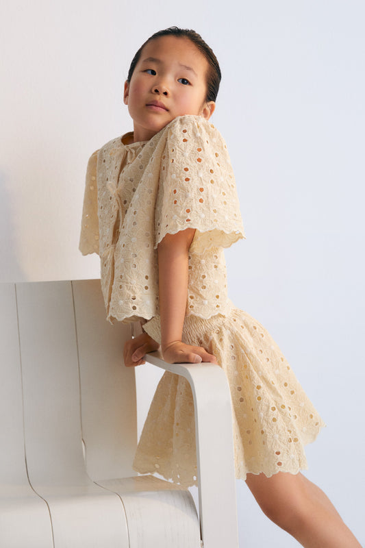 Creta Skirt in embroidered blend cotton fabric in macadamia color, featuring an elastic waistband.