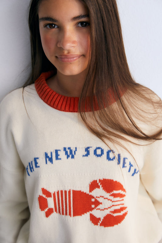 Sweater with contrast ribs on the neckline, cuffs, and hem, and our lobster jacquard on the front, making it a fun garment.