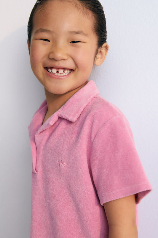 Terry fabric polo shirt with brand logo  embroidery on the chest in a matching color. Perfect for pairing with the matching shorts to create a summery look. The New Society. kids collection