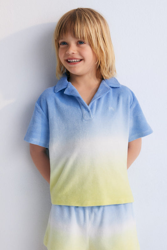 Tie-dye terry fabric polo shirt with brand logo prominently embroidered on the chest. Perfect for pairing with the matching shorts to create a summery look.